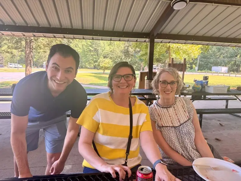 Three Trauma Specialists clinicians at a summer team picnic